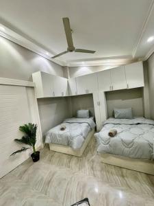 Postel nebo postele na pokoji v ubytování 2Bedrooms Penthouse's-New Cairo