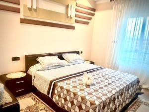 Postel nebo postele na pokoji v ubytování Abraj Dubai 3 bedroom luxury apartment