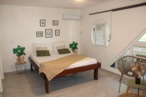 Llit o llits en una habitació de COCON DES ANTILLES