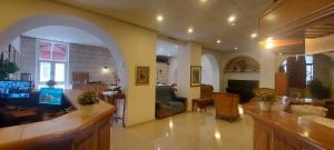 a living room with an archway and a living room at Zion Hotel in Jerusalem