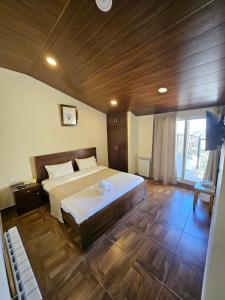 Postel nebo postele na pokoji v ubytování Hotel L'Aiglon
