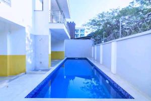 a swimming pool on the roof of a house at New Luxe 3 BR oceanview Nyali in Bamburi
