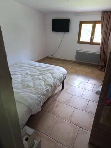 Ένα ή περισσότερα κρεβάτια σε δωμάτιο στο L'auberge du Berger