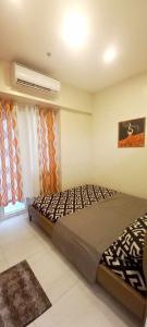 Postel nebo postele na pokoji v ubytování Paradise Point Staycation