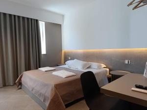 A bed or beds in a room at Hotel Valle Verde