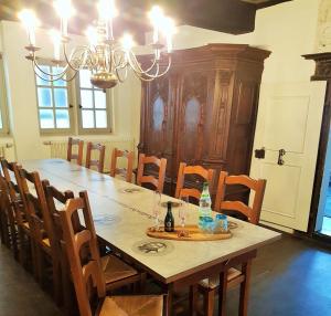 a dining room with a large table and chairs at Lutherwohnung Schmalkalden in Schmalkalden