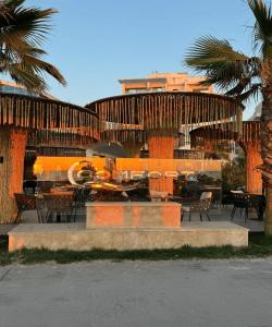 a building with a fountain with tables and chairs at Comfort Suites in Golem