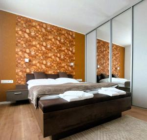Postel nebo postele na pokoji v ubytování Three Diamonds Residence