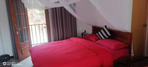 Postel nebo postele na pokoji v ubytování Isuru Homestay