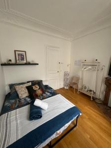 a bedroom with a large bed in a room at Beautiful Rooms nearby Champs Elysées in Paris