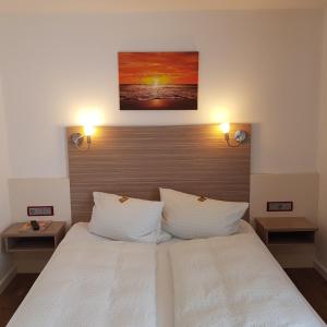 Postel nebo postele na pokoji v ubytování Hotel Mühleneck