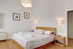 Postel nebo postele na pokoji v ubytování Villa Luna Rossa