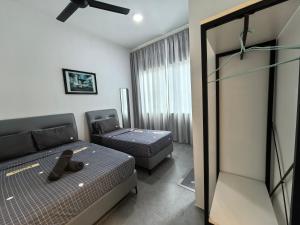 a hotel room with a bed and a window at Langkawi Simfoni Cassia Suite 09 9 Pax in Kuah +99 photos