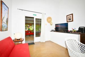 TV a/nebo společenská místnost v ubytování Villa de la Vallée