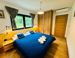 Postel nebo postele na pokoji v ubytování Wellness & View Skrzyczne - sauna, jacuzzi w cenie