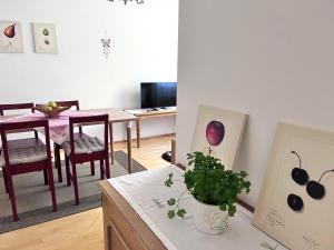 a living room with a table and a dining room at Appartment Weitblick in Eisenstadt