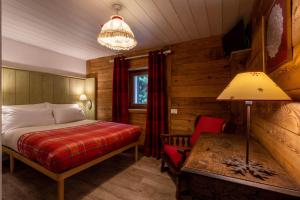 Postel nebo postele na pokoji v ubytování Hotel Petit Dahu - Chambres et Restaurant