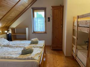 a bedroom with two bunk beds and a window at Apartment Milly in Bled