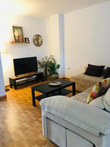 a living room with a couch and a coffee table at Una casa en el lago in Arcos de la Frontera +55 photos
