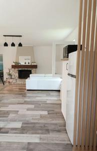 a kitchen with a bath tub in a room at La passerelle ,Montreuil ,Le Mans in Neuville-sur-Sarthe