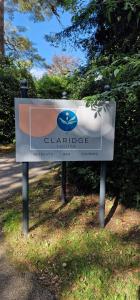 a sign in the middle of a park at Claridge House Retreat Centre Inc Continental Vegetarian or Vegan Breakfast in Lingfield