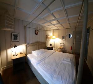 Una cama o camas en una habitación de B&B Langenberg