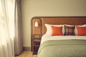 Voodi või voodid majutusasutuse The Leddie Hotel toas