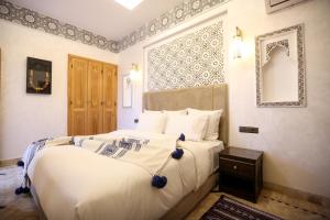 Postel nebo postele na pokoji v ubytování Riad Palais MERYEM