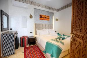 Postel nebo postele na pokoji v ubytování Riad Palais MERYEM