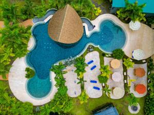 an overhead view of a swimming pool at a resort at Arenal Backpackers Resort in Fortuna +96 photos