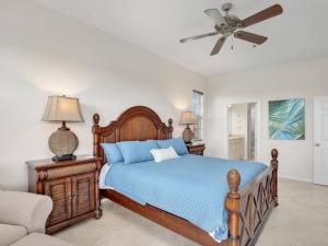 a bedroom with a bed and a ceiling fan at Elevated 886 Amazing Condo Park View in Marco Island +21 photos