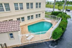 an overhead view of a house with a swimming pool at Elevated 886 Amazing Condo Park View in Marco Island