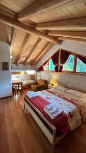 Postel nebo postele na pokoji v ubytování Chalet Maso Salam