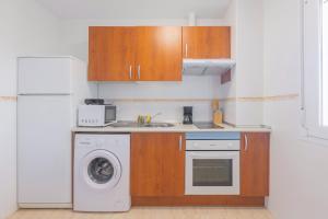 A kitchen or kitchenette at Apartamentos Moon Dreams Almerimar