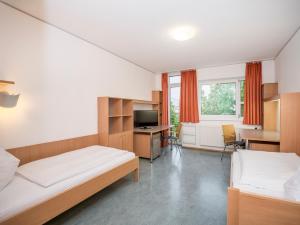 Posteľ alebo postele v izbe v ubytovaní Kolpinghaus Salzburg - SommerHOSTEL + 22 fotografií