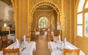 a dining room with tables and chairs in a restaurant at Hotel Marhaba Beach in Sousse