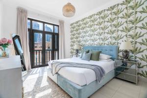 En eller flere senge i et værelse på GuestReady - Downtown lux near Burj Khalifa