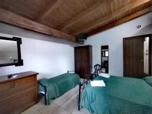 a bedroom with two beds and a flat screen tv at Holiday Residence in Casamassima