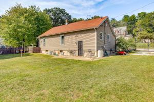 a house with a red roof on a yard at 25 Mi to Starved Rock State Park - DePue Retreat in Spring Valley