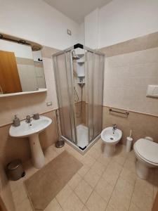 a bathroom with a shower and a toilet and a sink at CAGLIARI - Appartamento Asfodelo in Cagliari