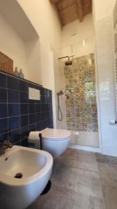 a bathroom with a sink and a toilet and a shower at 50&50 Sestri Levante in Sestri Levante