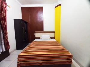 Guest House Syariah GS Sakinah, Kota Metro客房内的一张或多张床位