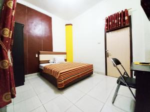 Guest House Syariah GS Sakinah, Kota Metro客房内的一张或多张床位