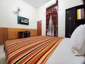 Guest House Syariah GS Sakinah, Kota Metro客房内的一张或多张床位