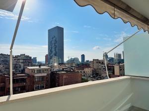 a view of a city skyline from a balcony at Smart Rent Apartment in Tirana