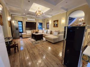 a living room with a couch and a table at Mount Grand Boutique - 110 Mount Street in Johannesburg