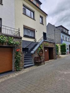 a building with stairs on the side of it at Ferienhaus Heimes in Klotten