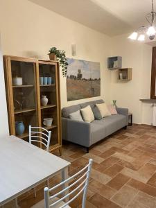 a living room with a couch and a table at Casa DOLCE VITA centro di Pistoia in Pistoia