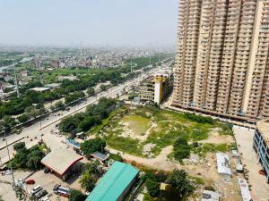 an aerial view of a city with a large building at Royal orbit studio in Ghaziabad