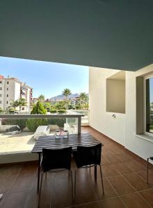 a dining room with a table and two chairs at Casa Marita in El Verger